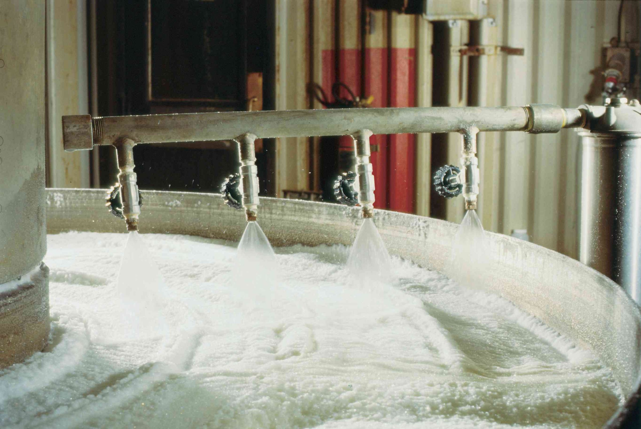 Foam control nozzles at a distillery.